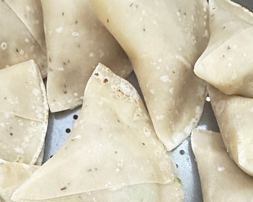 Authentic handmade frozen Shahi Paneer samosa Indian vegetarian snack.