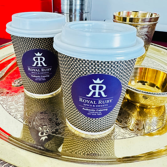 A steaming, golden-hued cup of authentic Indian Punjabi Chai brewed with milk and traditional spices.