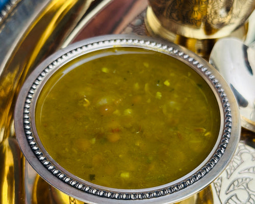 Authentic Indian catering large food tray featuring traditional dal.