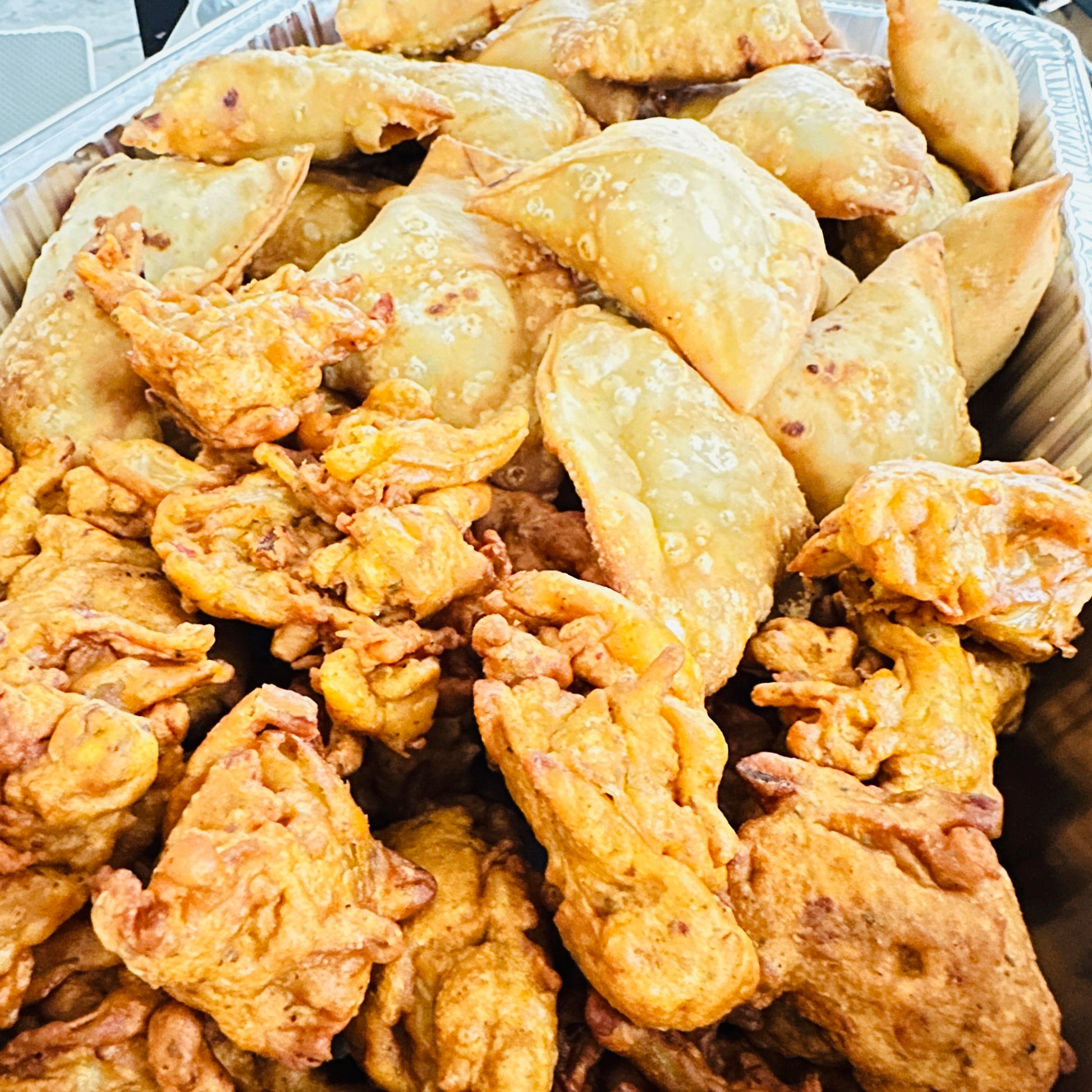 Freshly fried vegetable samosas for Indian party catering in Brampton.