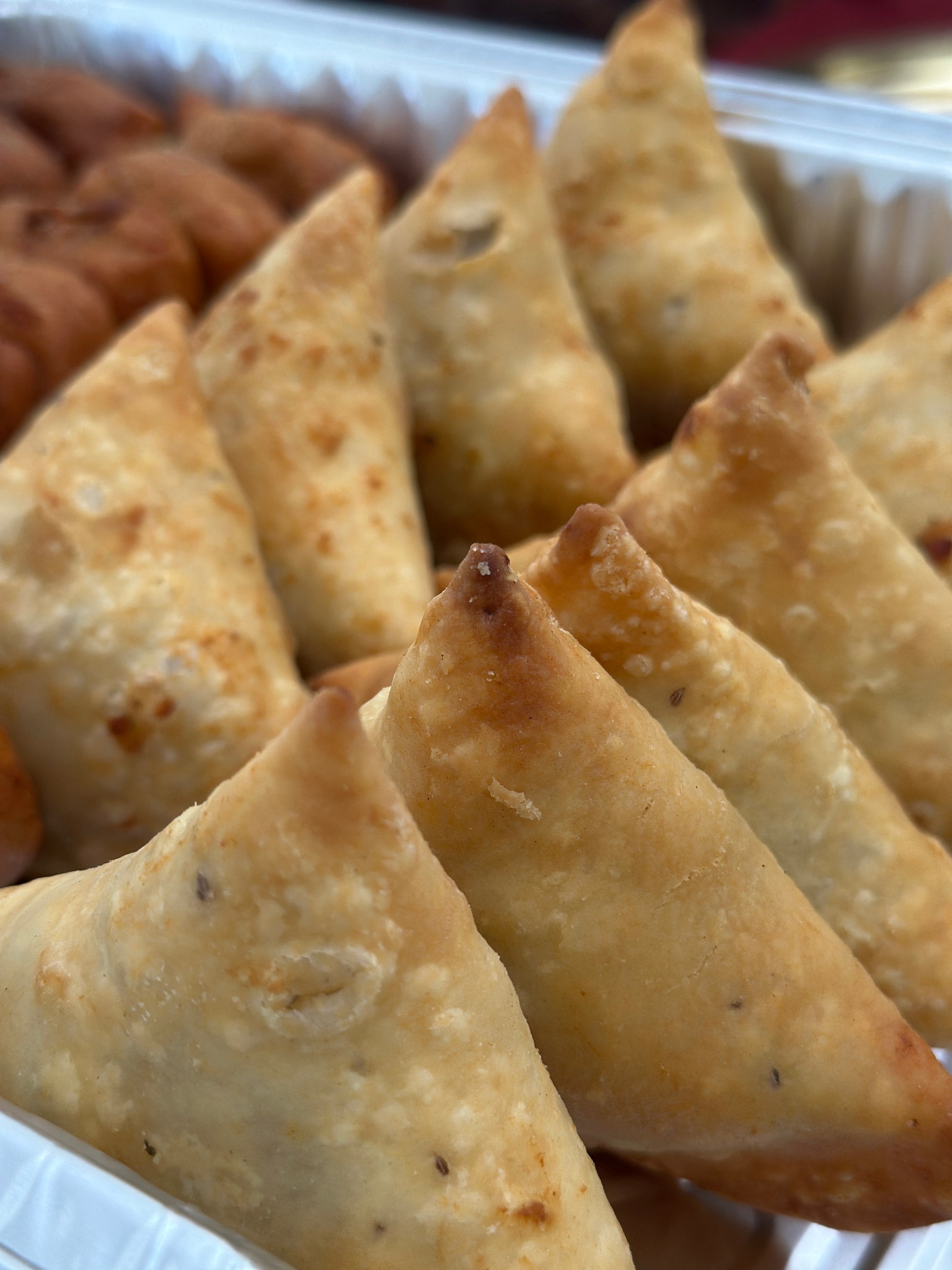 Freshly fried vegetable samosas for Indian party catering in Brampton.