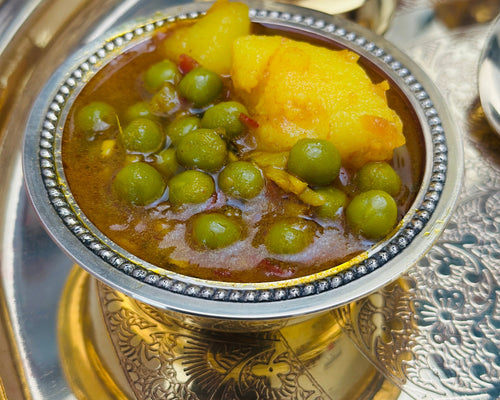 Indian catering large food tray featuring authentic vegetarian sabzi curry.