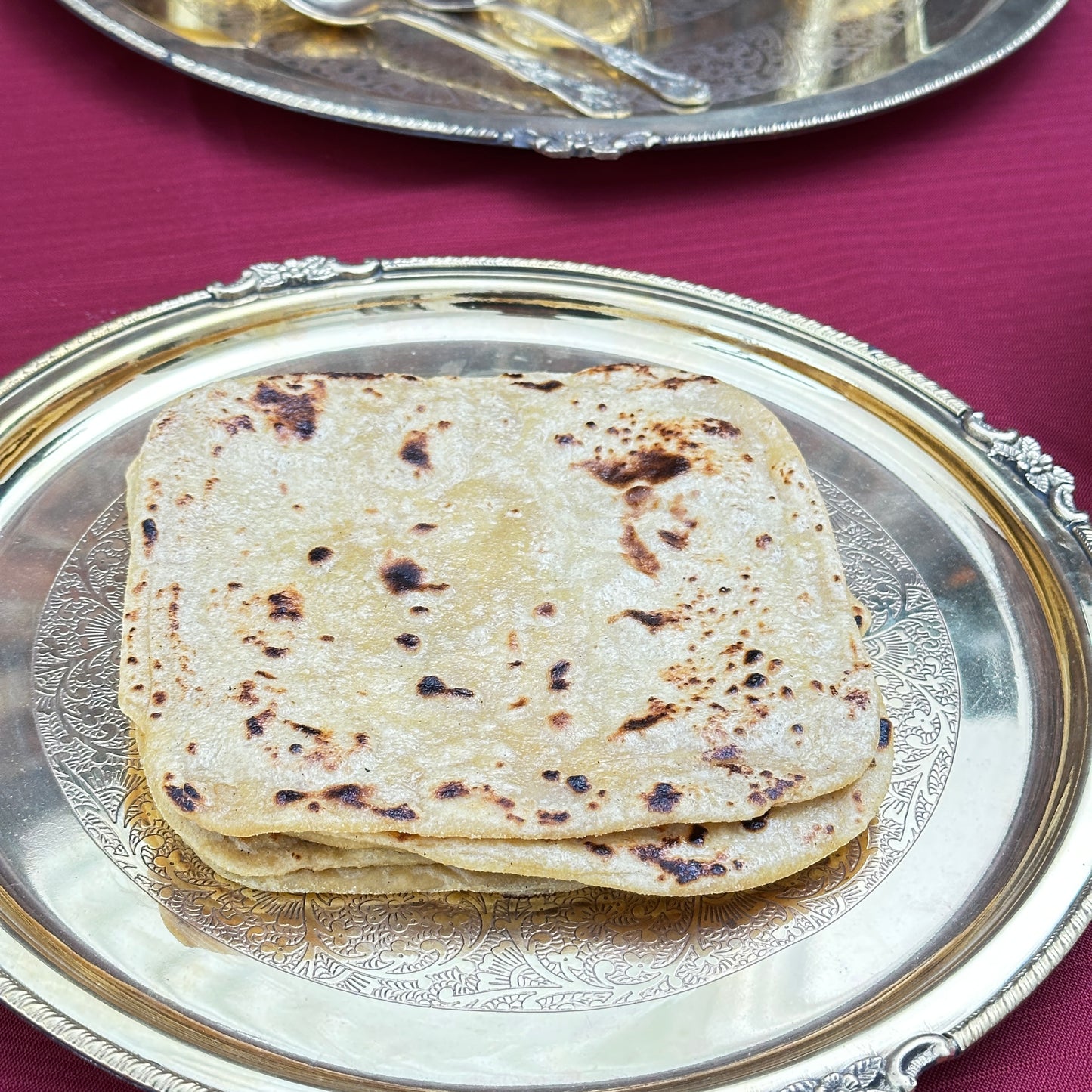Royal Ruby Plain Paratha – freshly made flaky whole wheat flatbread, golden-brown and layered, cooked on a traditional tawa