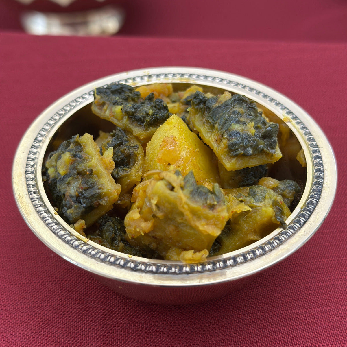 Royal Ruby Karela Sabzi – authentic Indian bitter gourd curry cooked with onions and aromatic spices in Punjabi style