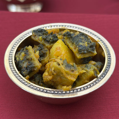 Royal Ruby Karela Sabzi – authentic Indian bitter gourd curry cooked with onions and aromatic spices in Punjabi style
