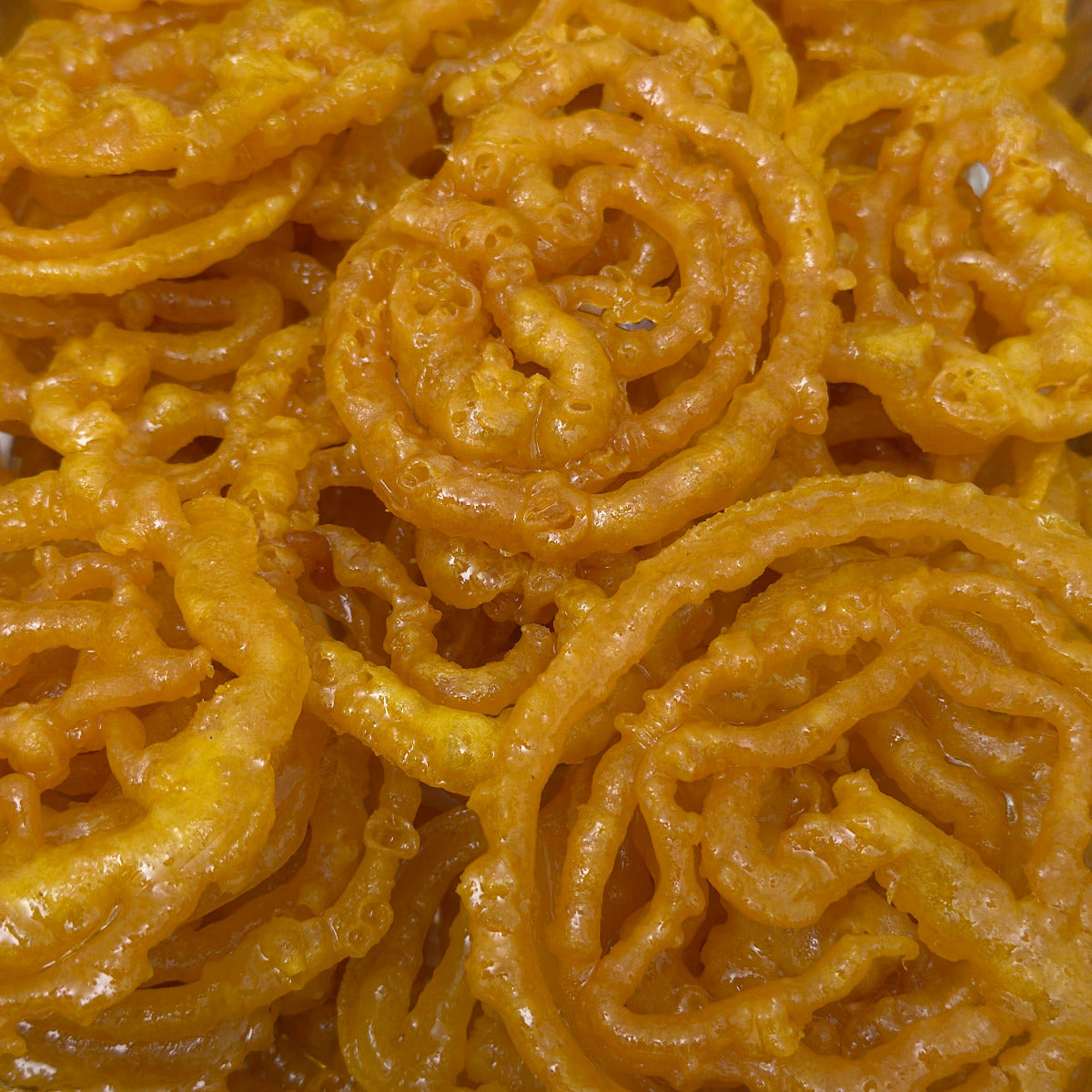 Royal Ruby Jalebi – crispy golden orange swirls soaked in sugar syrup, a popular traditional Indian sweet, 1LB serving