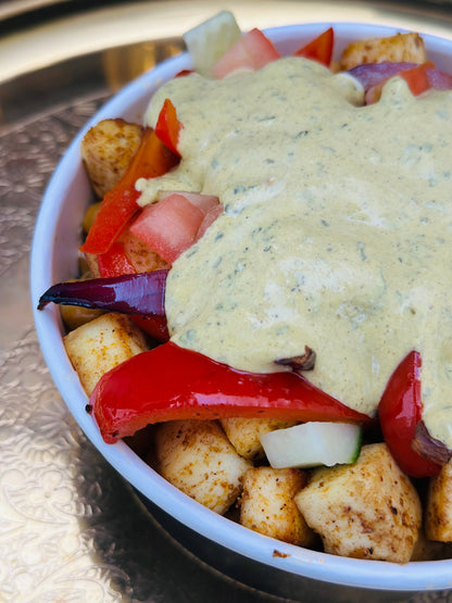 Close-up of spiced paneer and roasted peppers in a Royal Ruby Protein Bowl